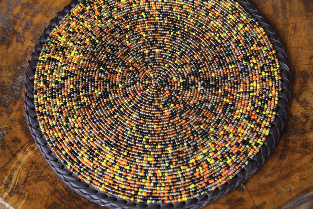 Circular Intricately Beaded Leather Placemat