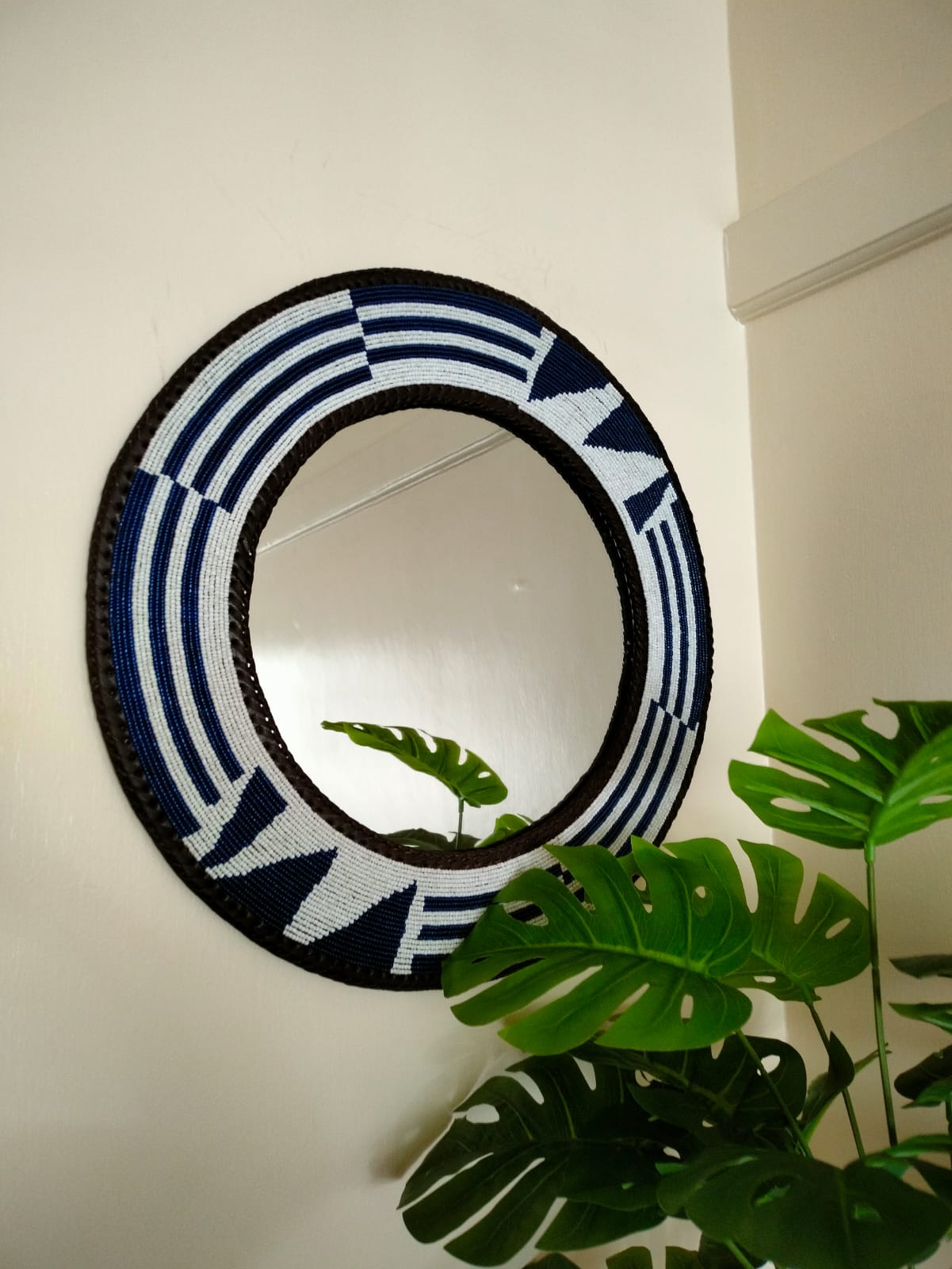 Midnight blue beaded mirror.