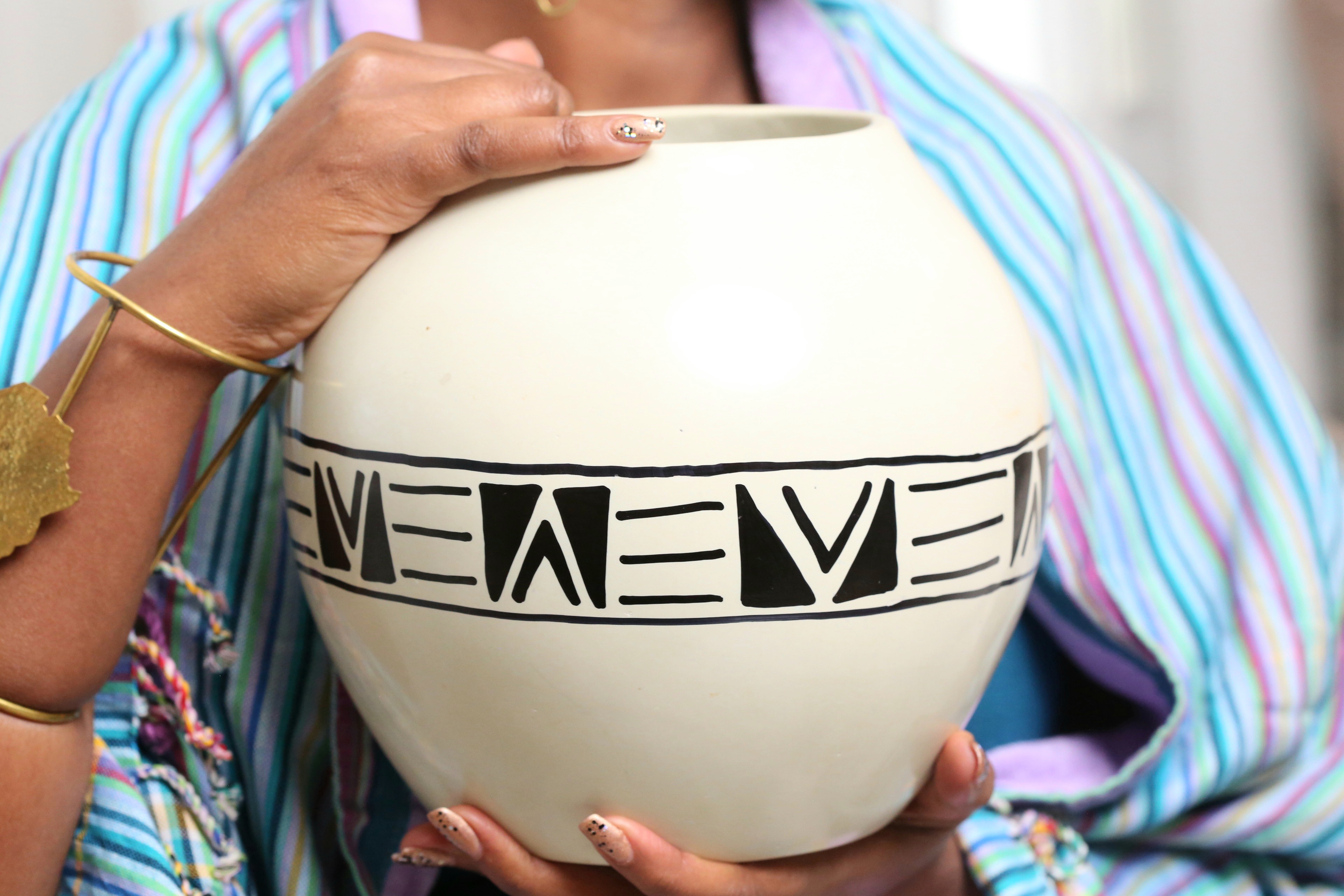 Elegant circular soapstone white vase.