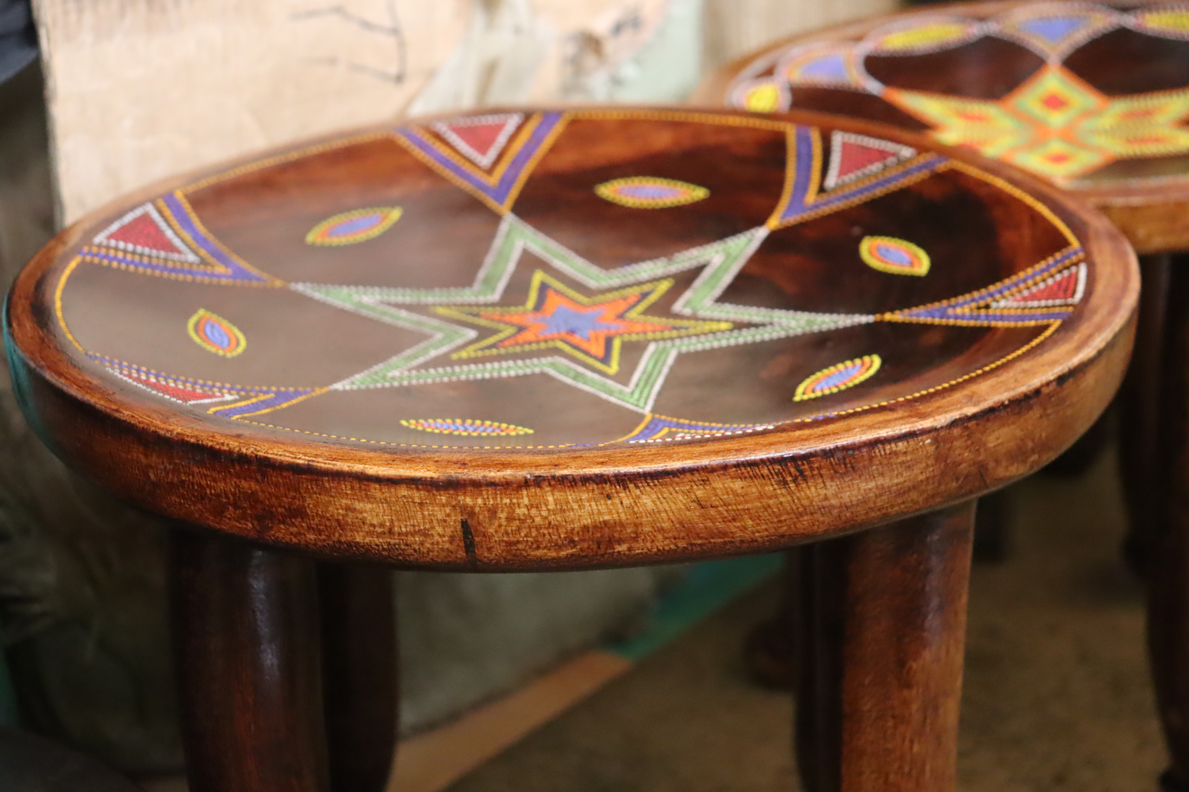 Timeless 4-legged traditional stool with beaded star pattern