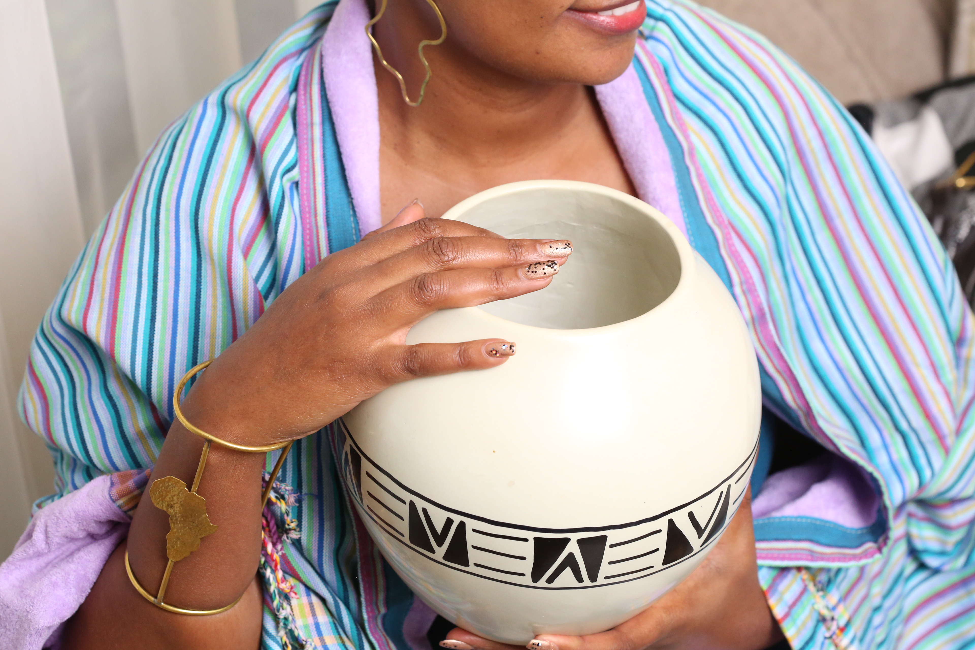 Elegant circular soapstone white vase.